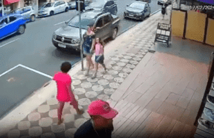 Woman Gets Stomped By Man For Randomly Hitting A Child While With Her Mother!