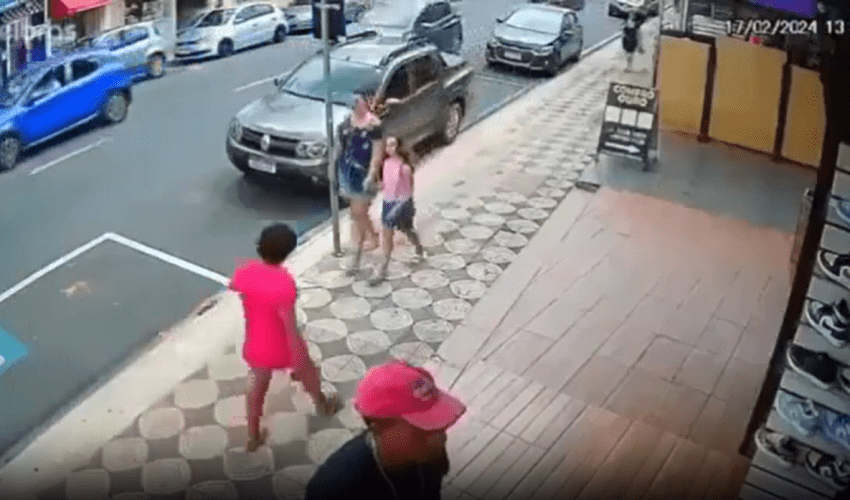Woman Gets Stomped By Man For Randomly Hitting A Child While With Her Mother!