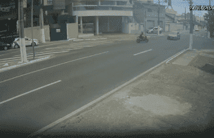 Dude On Motor Bike Gets Caught Lacking By A Car!