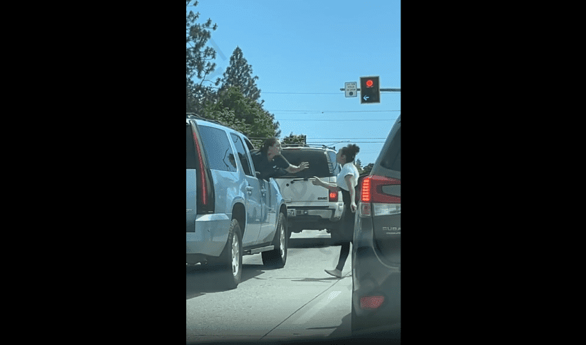 Woman That Was Ready To Catch A Fade Gets Into A Spitting Contest With Another Woman In Traffic During Road Rage