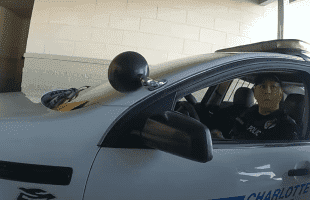 Charlotte Cop Caught On Camera Stealing Cash From A Detainee