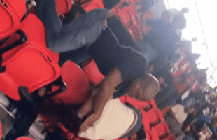 Dude Gets Slung Around By His Dreads For Talking Crazy At A Football Game