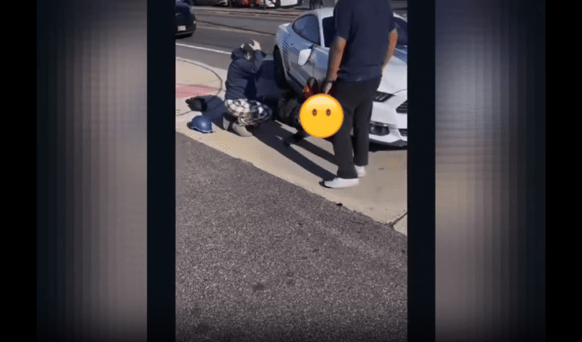 Dude Gets His Head Stuck Under A Car Wheel After He Was Hit By A Careless Driver