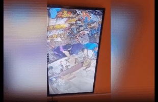 Store Owners Was Not Letting This Thief Escape After He Squeeze Thru Their Store Window To Steal