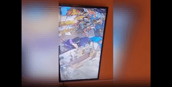 Store Owners Was Not Letting This Thief Escape After He Squeeze Thru Their Store Window To Steal