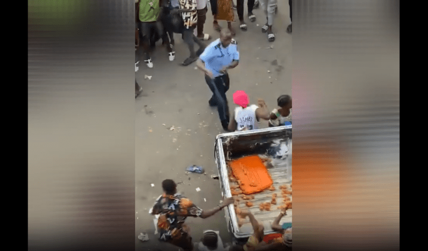 Nigeria Police Uses His Belt On Thieves After He Seen Them Stealing Food From His Police Truck