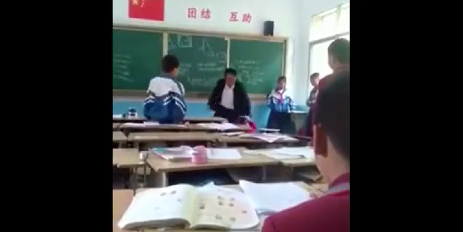 Chinese Teacher Beats Child In His Class For Acting Out! | TrollAlley.com