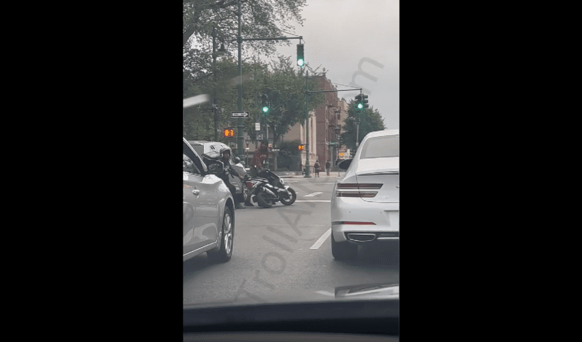 Dude Almost Got His Motor Scooter Took In Traffic But His Homie Pulled Up!
