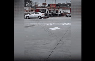 Dude Stood Over A Guy In Broad Daylight While Everybody Was Trying To Stop Him From Doing It