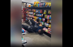 Police Officer Gets Handled By A Big Woman In A Store After He Tried To Arrest Her