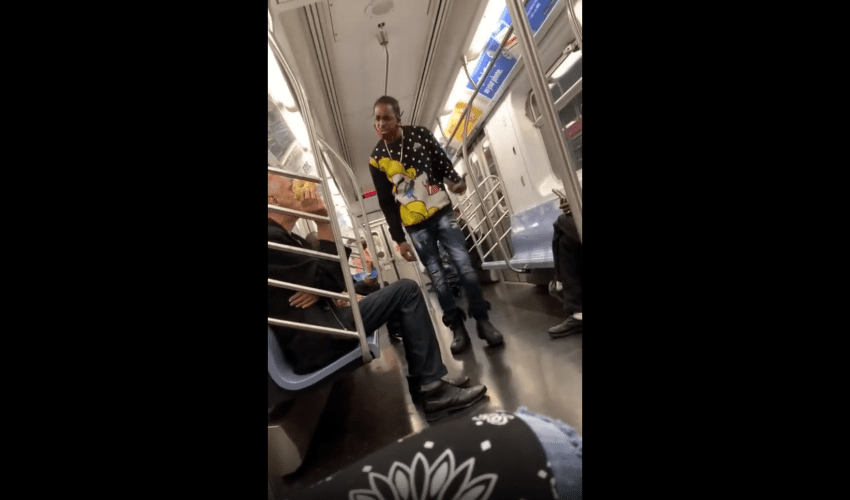 Old Guy With A Donut Gets Smacked After He Said The Wrong Word To A Man On The Train