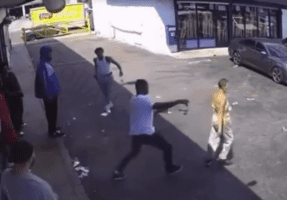Instant Karma: Woman Gets Saved After A Man Tripped Her For No Reason And Then His Opps Came Out Of Nowhere Shooting