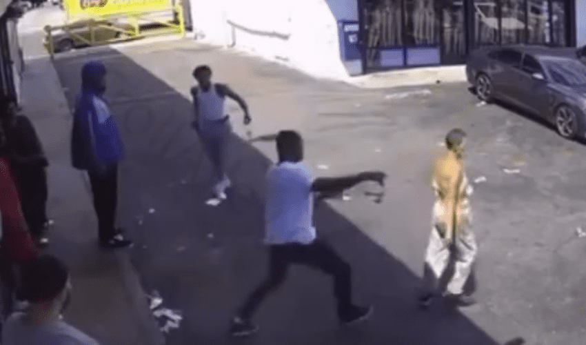 Instant Karma: Woman Gets Saved After A Man Tripped Her For No Reason And Then His Opps Came Out Of Nowhere Shooting