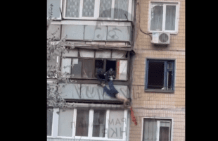 Dude Tried His Best To Jump Off A Building By Doing Anything Possible To Get Them To Let Go