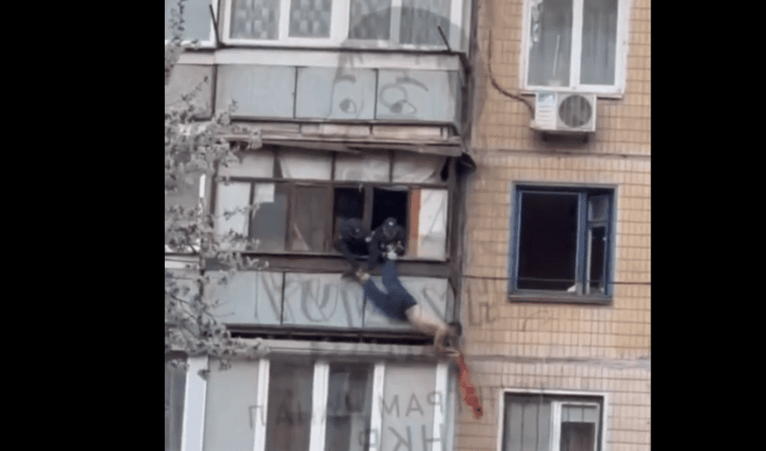 Dude Tried His Best To Jump Off A Building By Doing Anything Possible To Get Them To Let Go