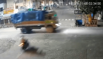 Man On Motorbike Meets Big Truck