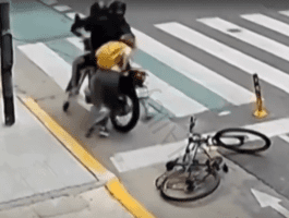 Woman Jumps On Robbers Motorcycle After They Tried To Take Her Unlocked Phone