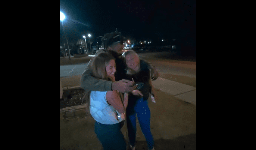 Two White Guys Had No Problem With Their Two Girlfriends Being Hugged On By A Black Guy While Taking A Picture