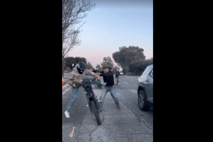 Dude Gets Pushed Off His Dirk Bike By A Guy For Riding Reckless In The Streets