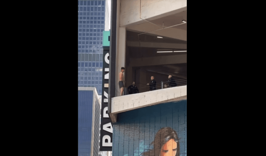 Bystander Encourages Man To Jump After Police Tried To Stop Him From Jumping