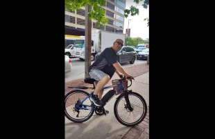 Man On A Bike Got Mad And Tried To Attack A Black Woman For Protesting About FBI Director Kash Patel And Kid Safety