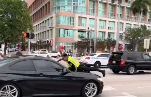 Miami Police Officer Missed At Close Range After Dude Drove Off With Him On The Hood Of His Car