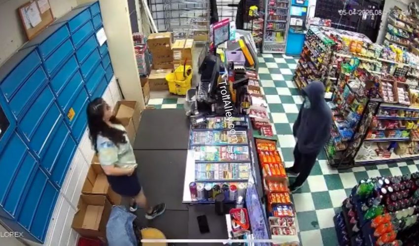 Man With A Gun Runs After Store Clerk Reach For Something Behind The Store Counter