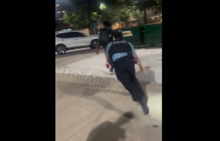Police Falls After Putting His Gun Away