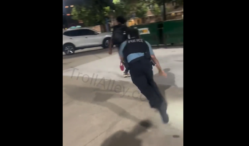 Police Falls After Putting His Gun Away