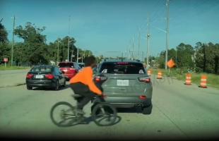 Man Caught This On His Dashcam After A Man Tried To Cross The Street With His Bike
