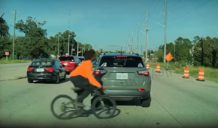Man Caught This On His Dashcam After A Man Tried To Cross The Street With His Bike