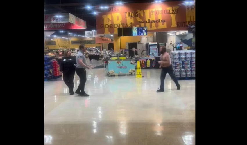 Security Guard Cracks A Man With A Chair After He Kept Trying To Put Hands On His Coworker After He Was Told To Leave The Store